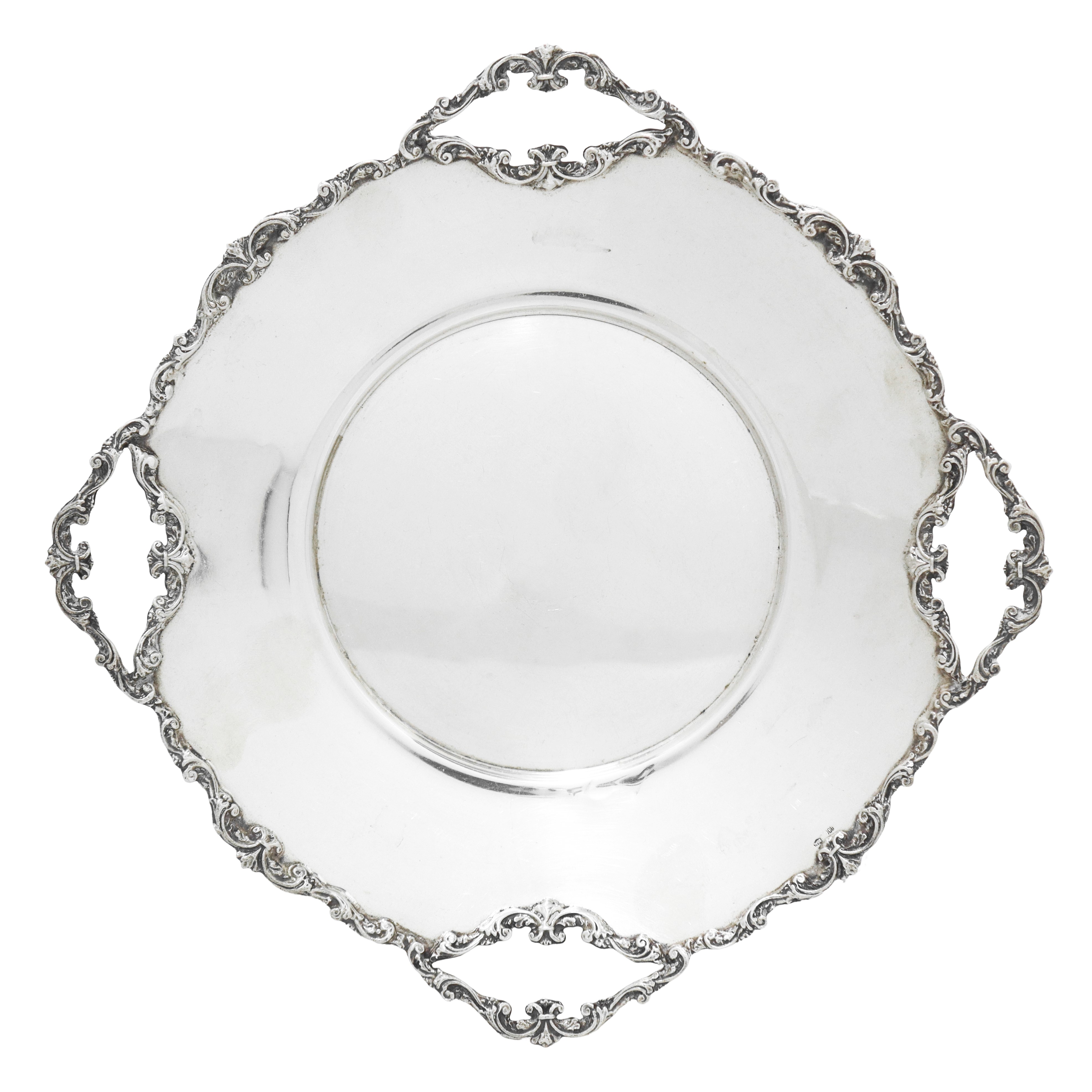 Alzata rotonda in argento 800 con bordo con quattro prese