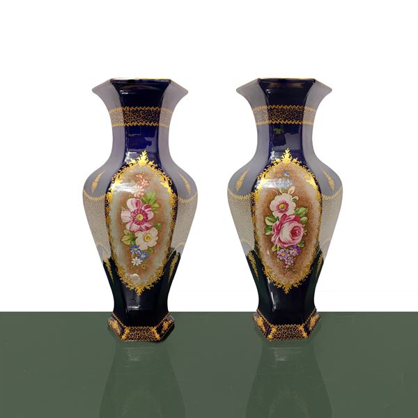 Pair of Sevres blue hexagonal vases with hand painted floral decorations