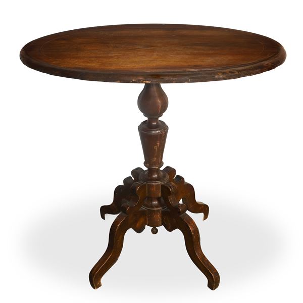Round table in walnut wood with 4-star base 