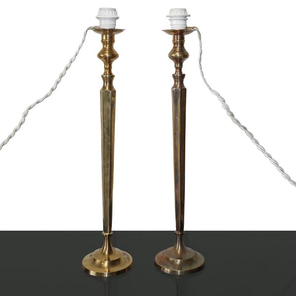Pair of gold metal candlesticks with a truncated pyramid hexagonal column stem 