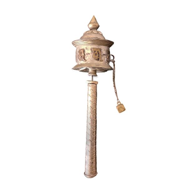 Tibetan prayer wheel with inscriptions