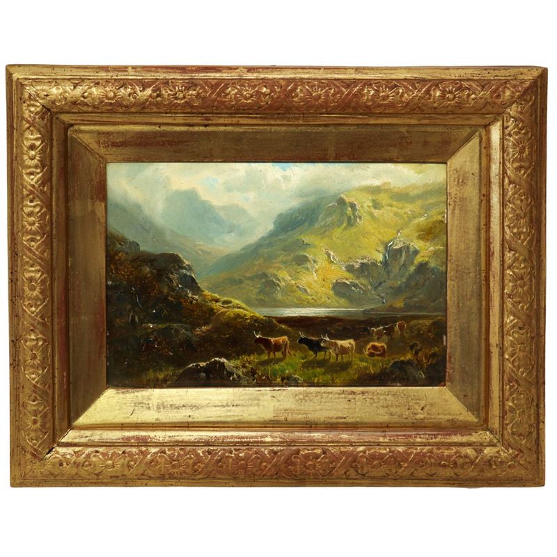 Paesaggio montano con lago e animali