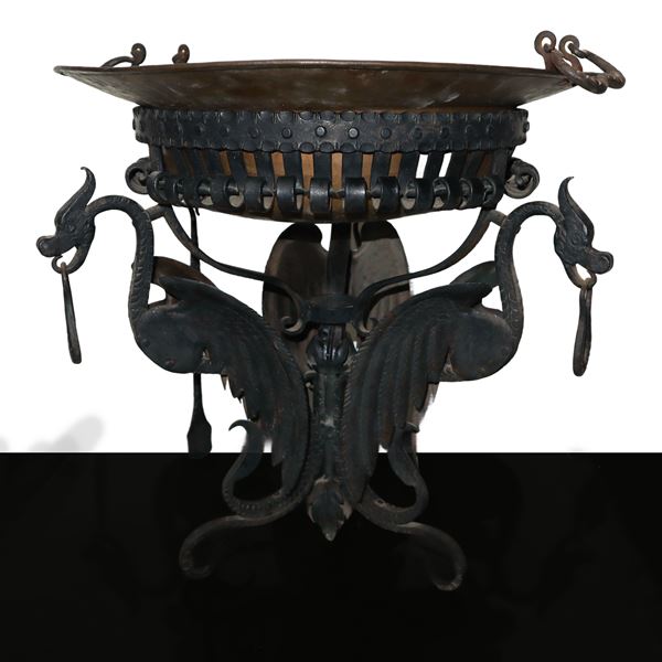 Wrought iron brazier with three supporting birds with shovel