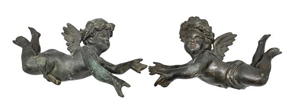 Pair of bronze angels, nineteenth century. Length 36 cm