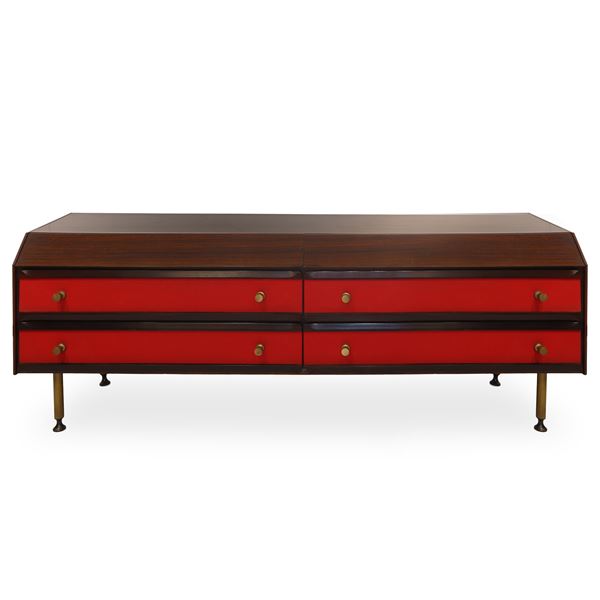 Rosewood chest of drawers with red fabric inserts and brass knobs and feet 