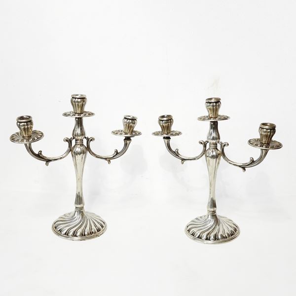 Pair of three-light silver candlesticks