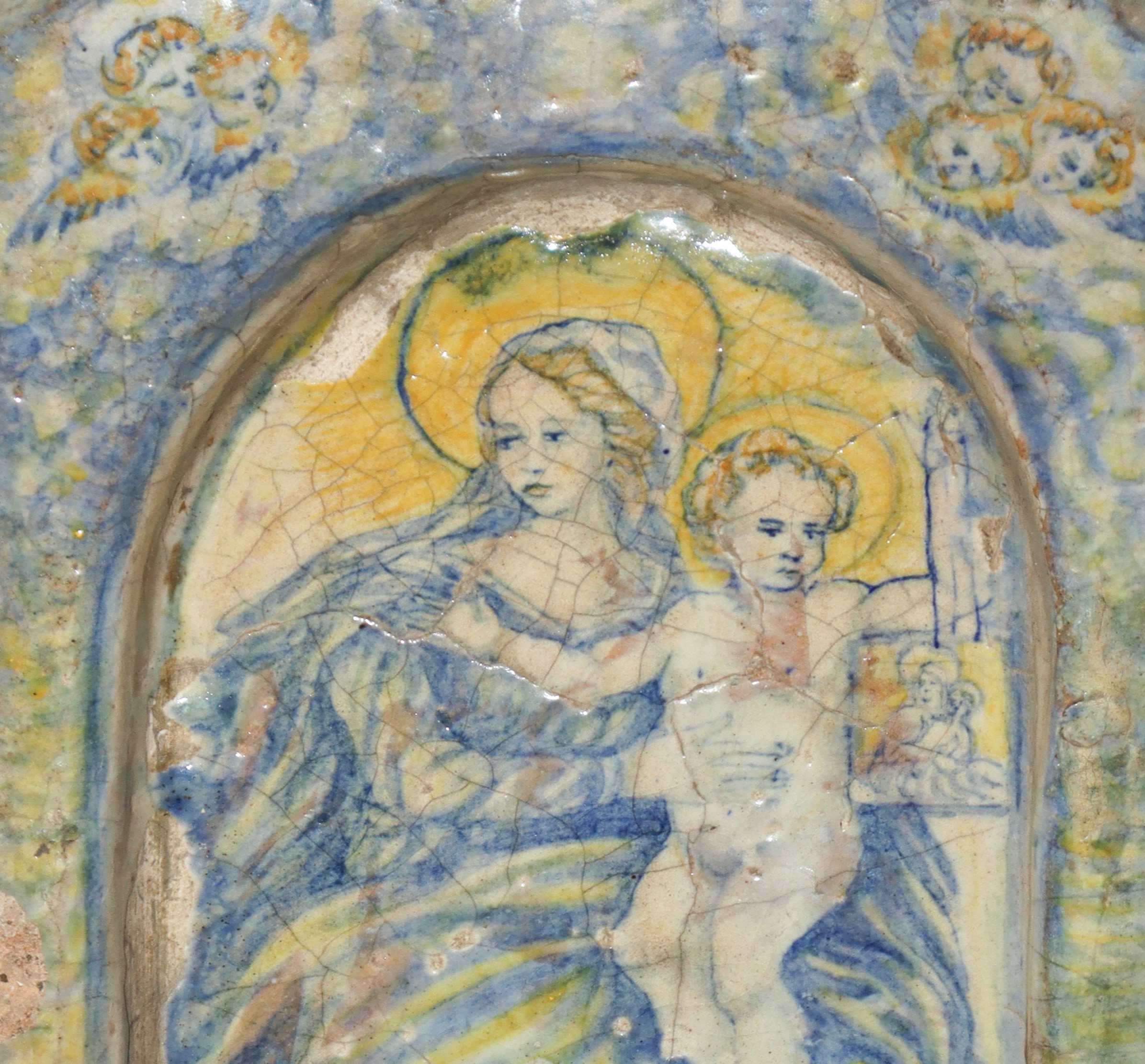 Madonna con bambino entro lunetta con zefiri, maiolica policroma invetriata, XVIII secolo, Centro...