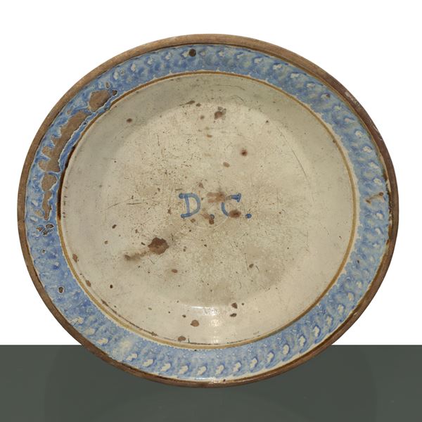 Caltagirone plate sponged blue on the edge and in the center with DC initials