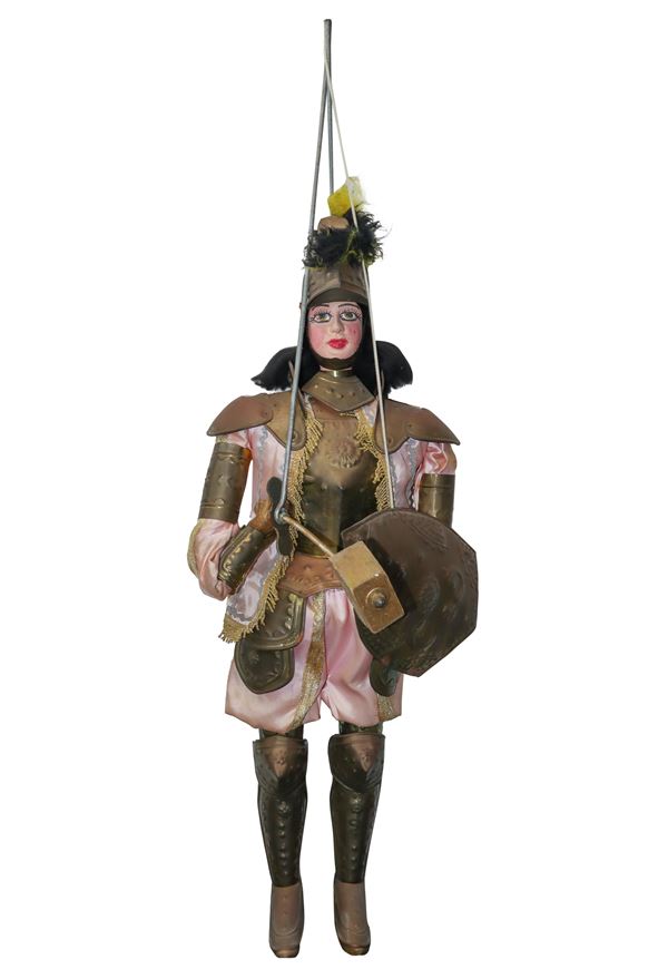 Sicilian puppet with metal armor and pink fabric clothes