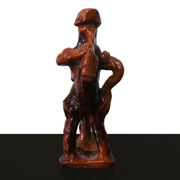 Whistle in the shape of a man on horseback in shades of brown