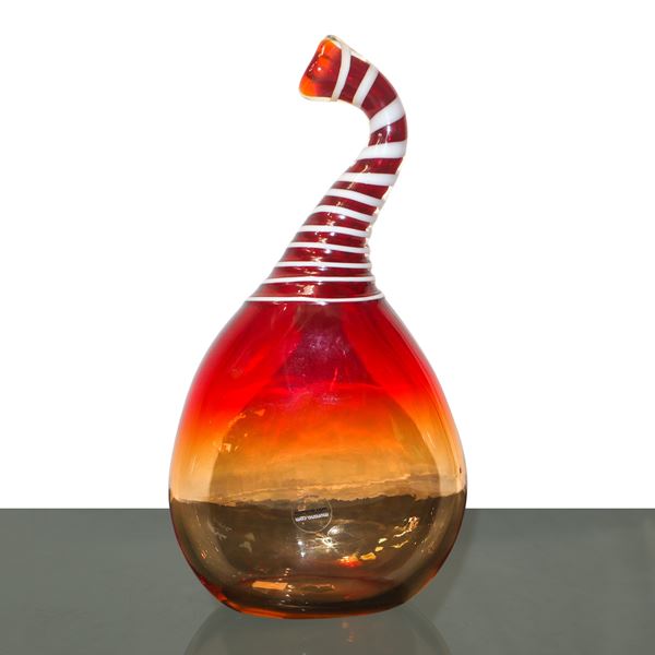 Blown glass bottle made in Murano in shades of orange and red