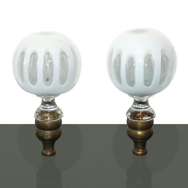 Pair of white glass and brass doorknobs