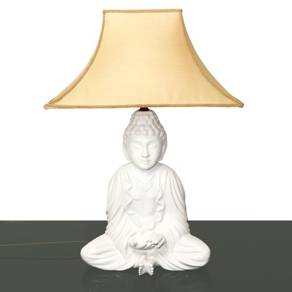 White ceramic table lamp with Buddha base