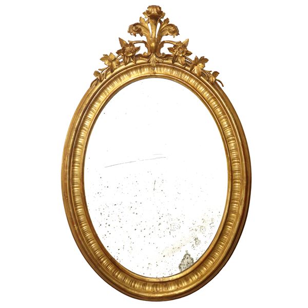 Specchiera ovale in legno dorato