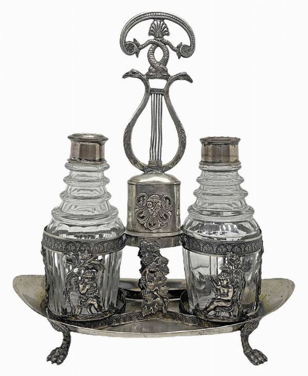 Salt with a lira socket with embossed putti, empire. Leonina feet. Early nineteenth century, germany origin, figures depicting pam and ...