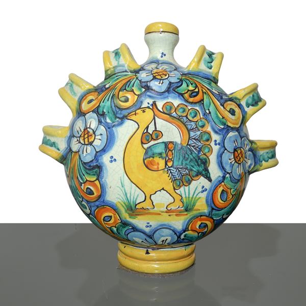 Ernesto Boria - Caltagirone majolica water bottle, enamelled and painted in polychrome with a peacock on the front
