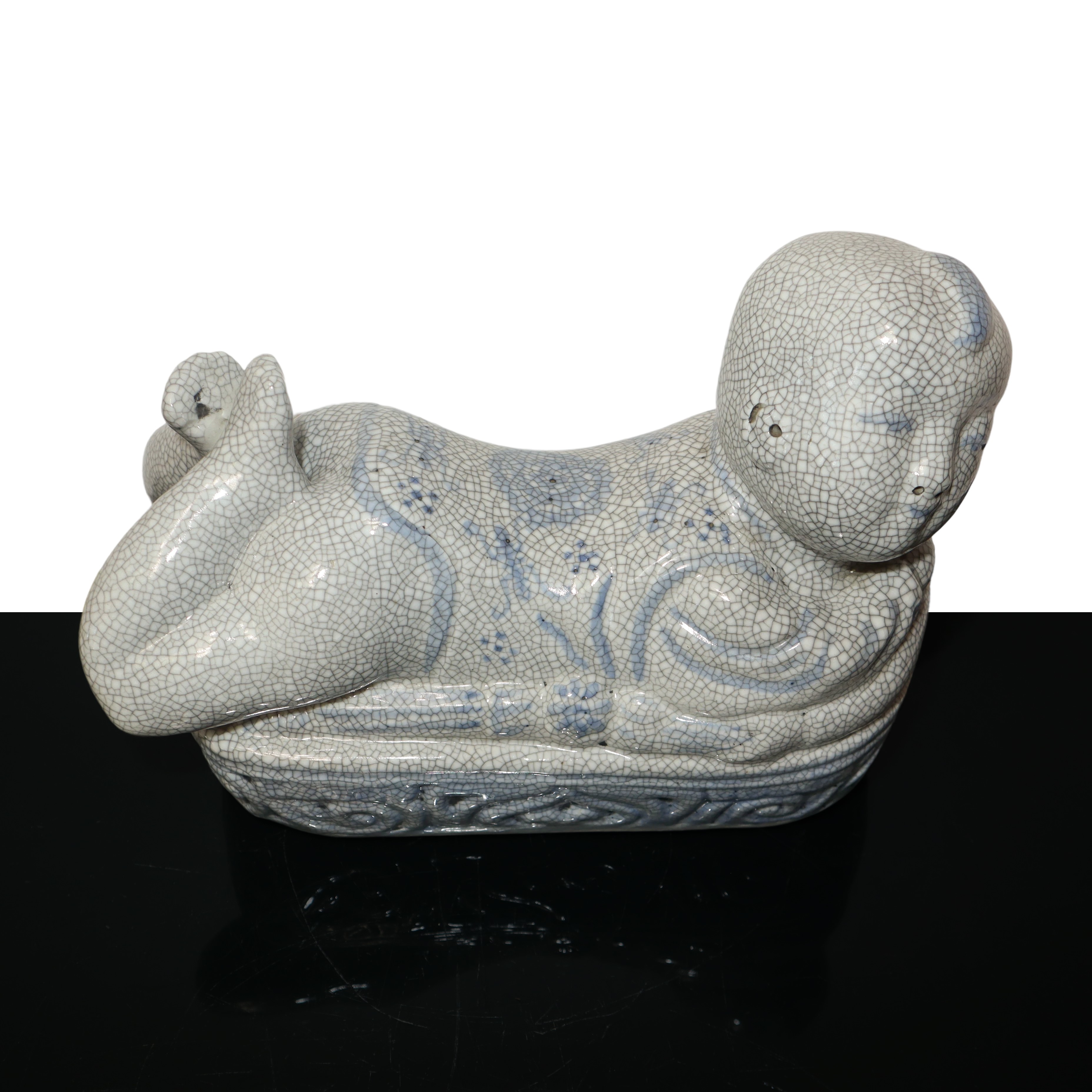 Scaldino in ceramica dalle fattezze di bambino