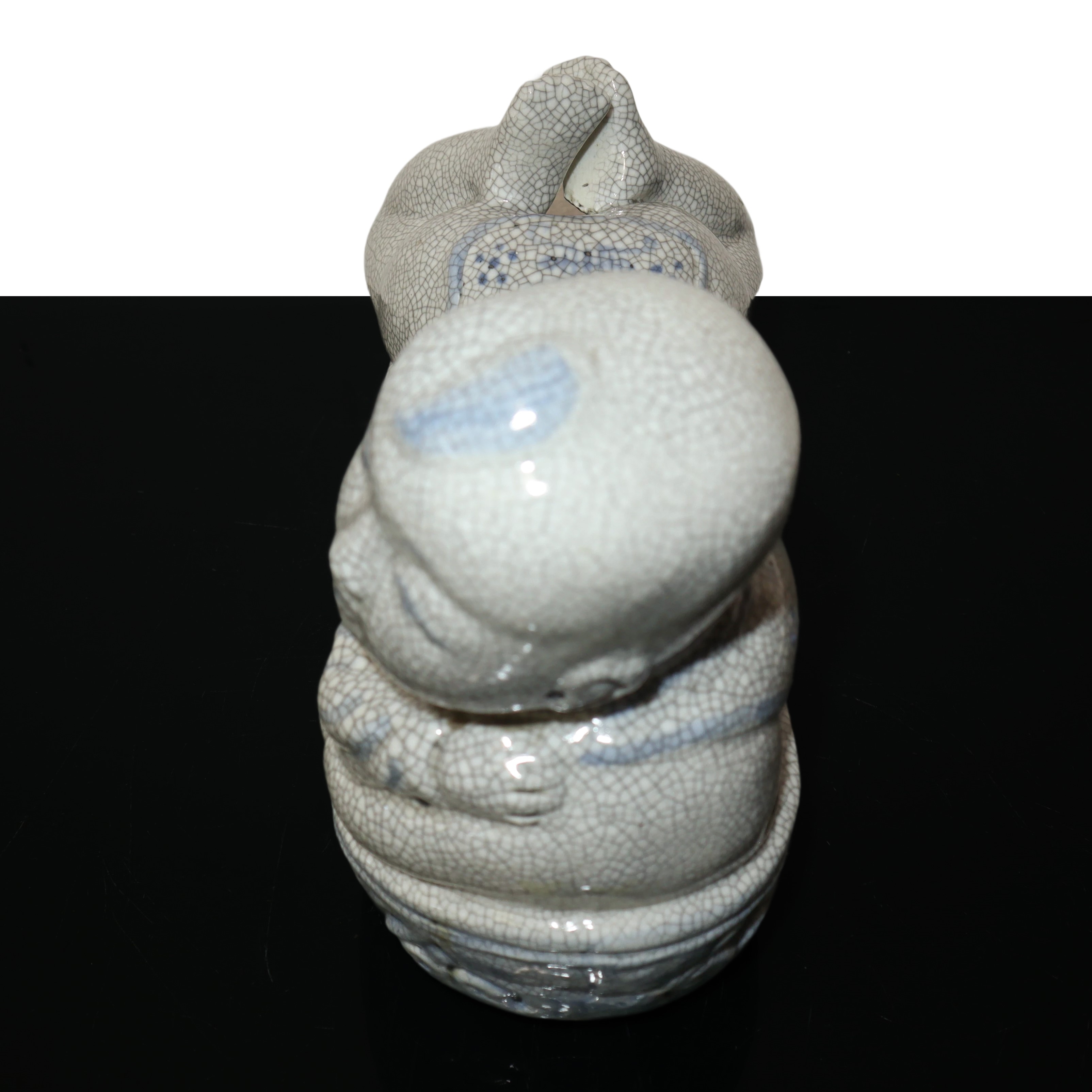 Scaldino in ceramica dalle fattezze di bambino