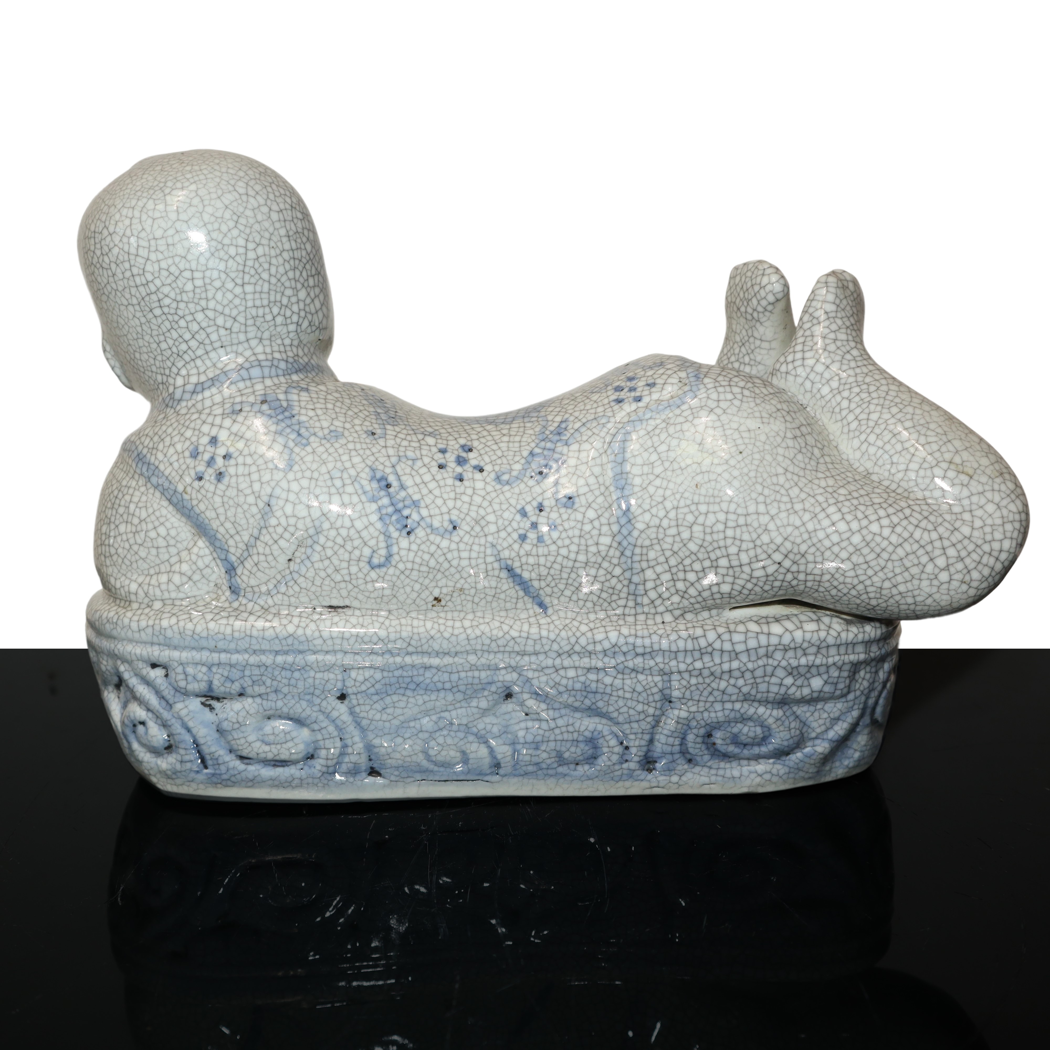 Scaldino in ceramica dalle fattezze di bambino