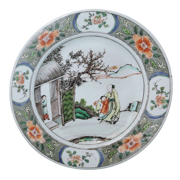 Piatto in ceramica cinese dinastia Qing periodo Kangxi con raffigurazione di un maestro con allievo