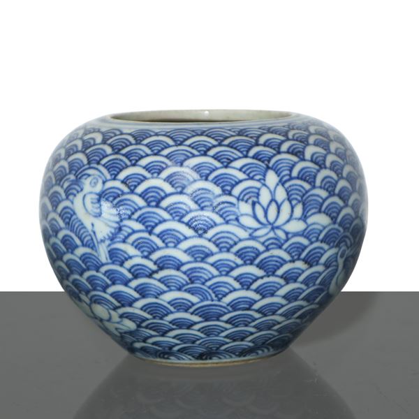 Brush wash in blue and white tones with fish scale motifs