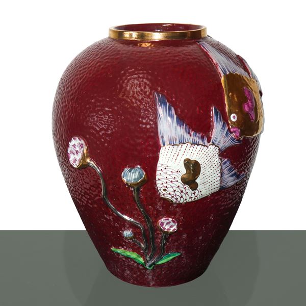 Burgundy ceramic vase with embossed fish and seaweed