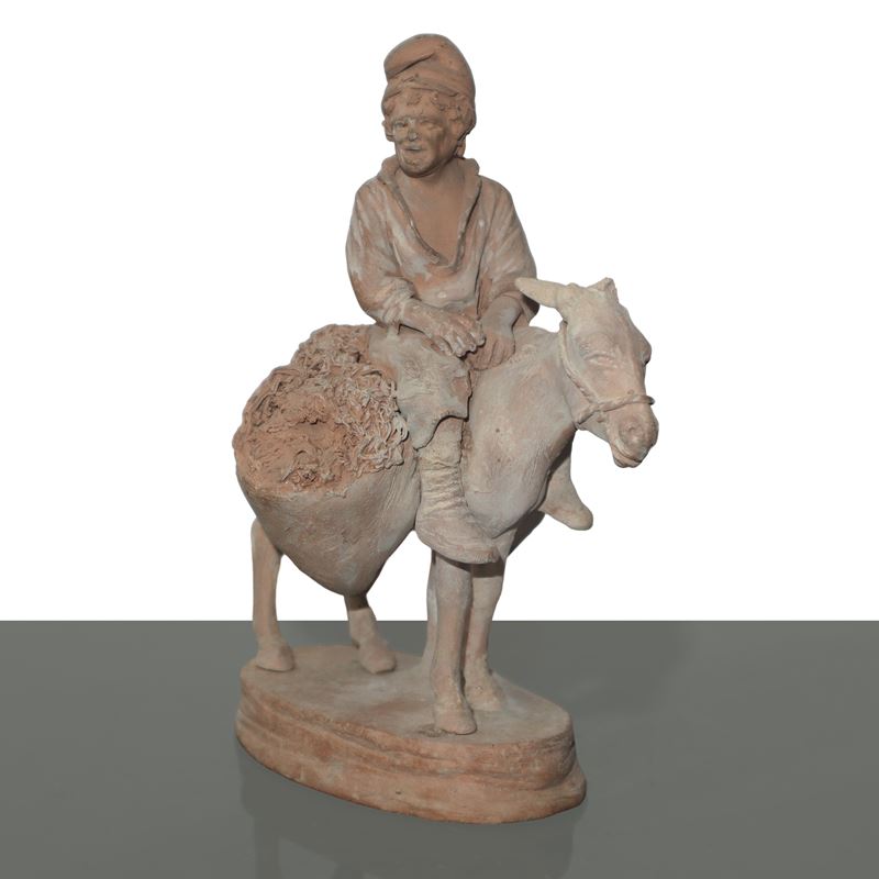 Uomo a cavallo d'asino