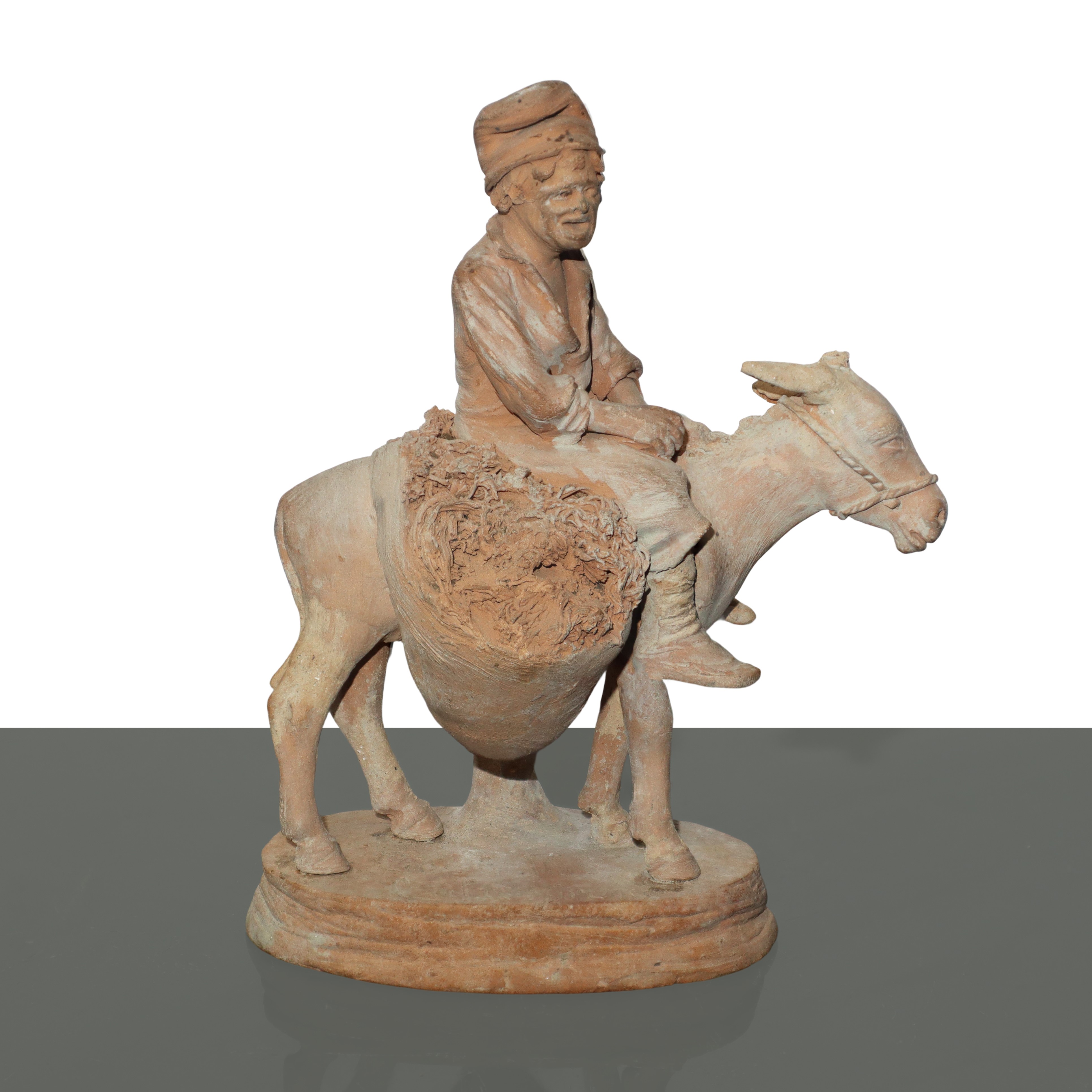 Uomo a cavallo d'asino