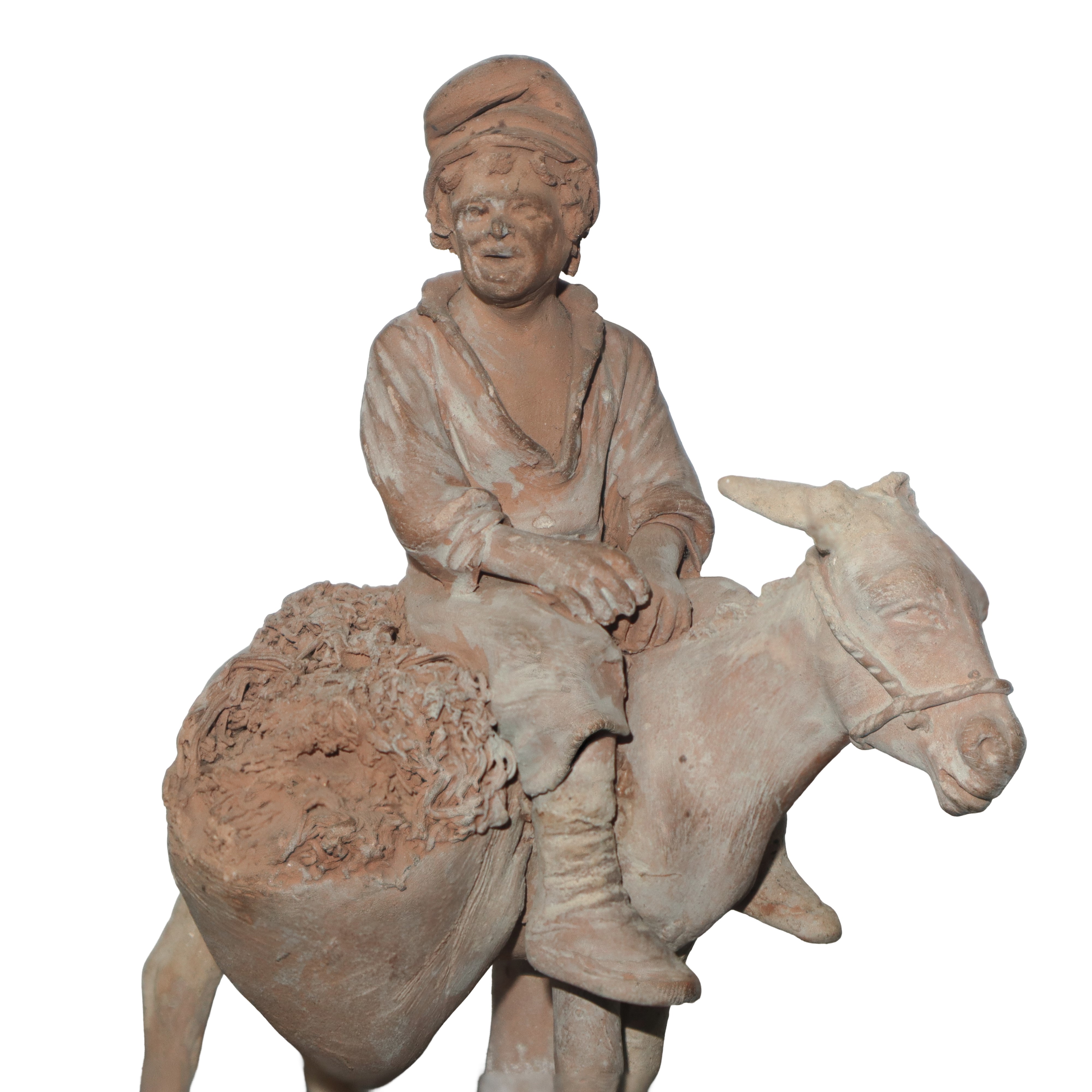 Uomo a cavallo d'asino