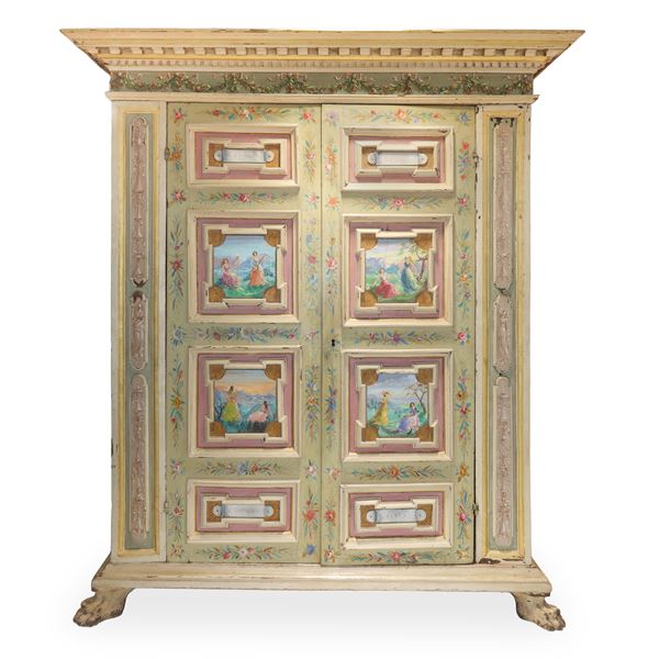 Lacquered and painted two-door wardrobe with four panels per door painted with scenes of female figures, a protruding serrated hat and feline feet