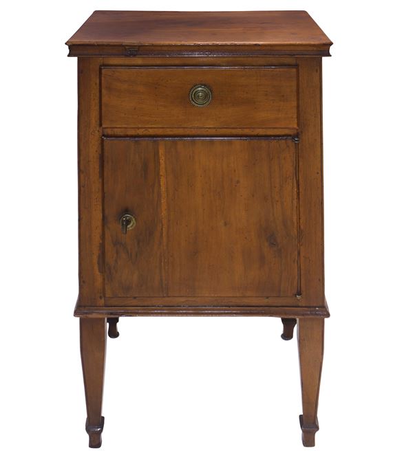 Bedside table in solid walnut, upper drawer and door at the base, truncated pyramid feet