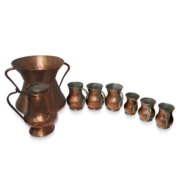 Group of 8 copper jugs of various sizes