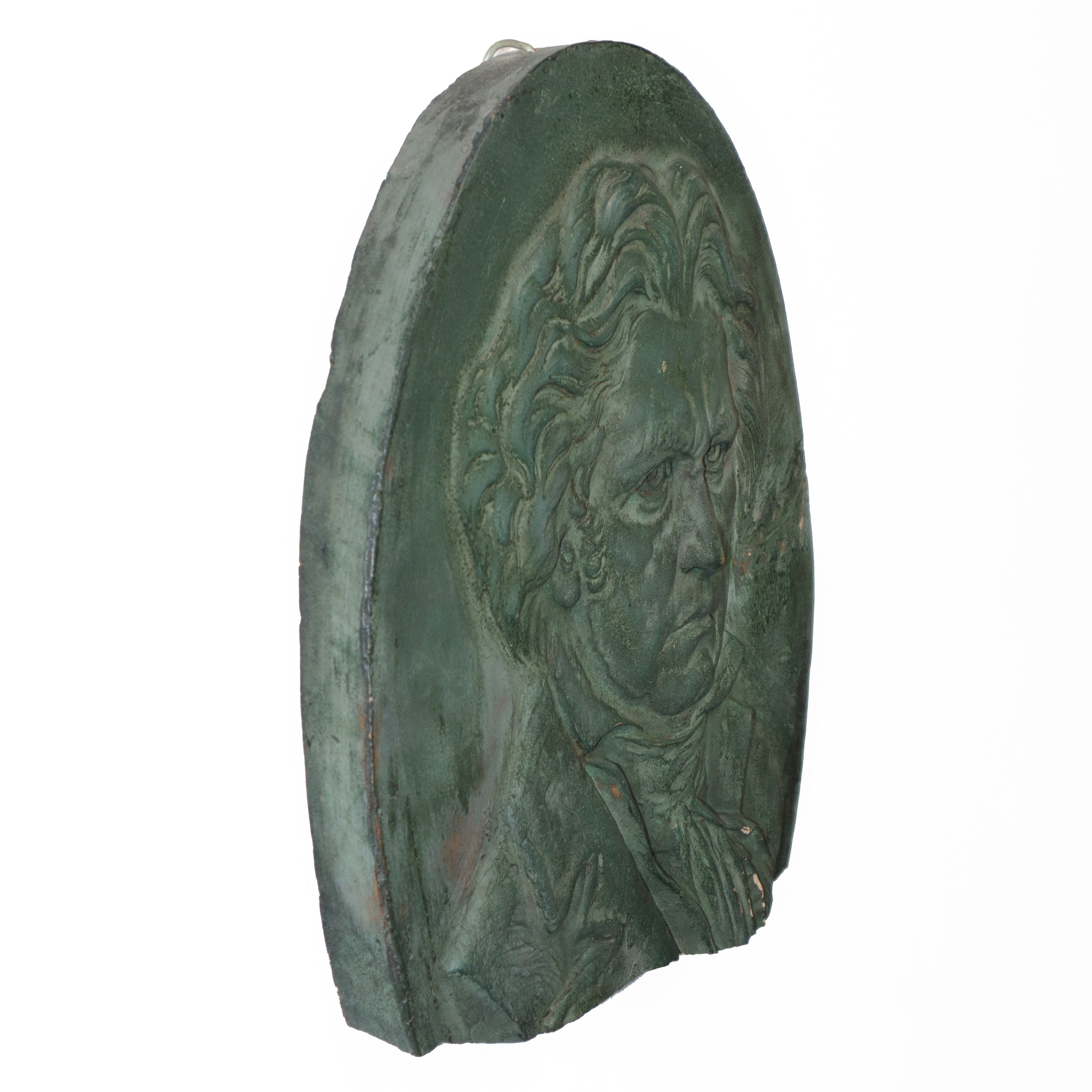 Beethoven, scultura da muro in cotto patinato verde.