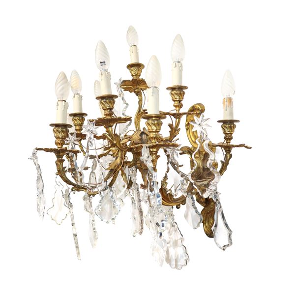Applique in metallo dorato a 9 luci con brindoli