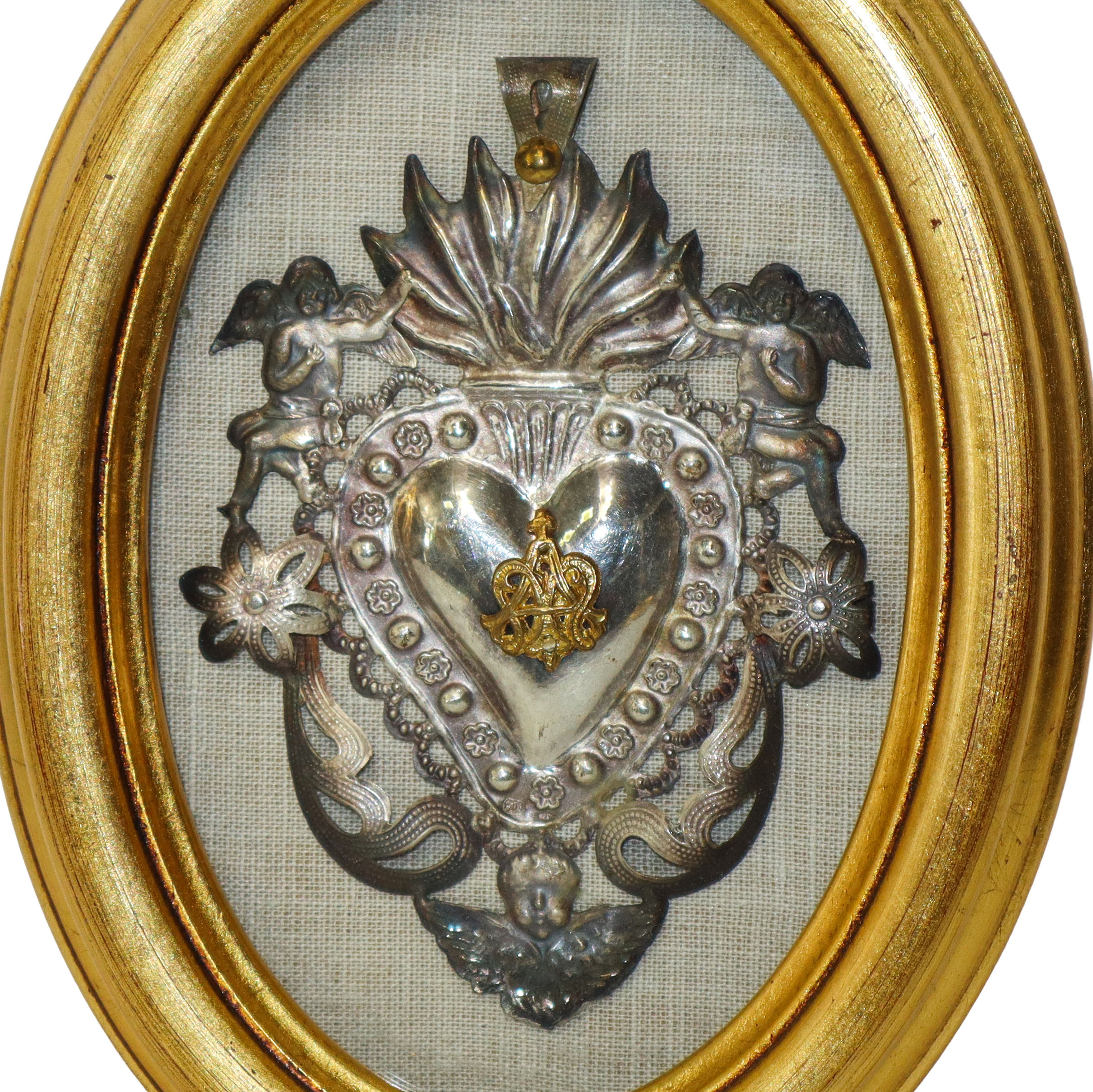 Coppia di Ex Voto in argento, cornici ovali dorate