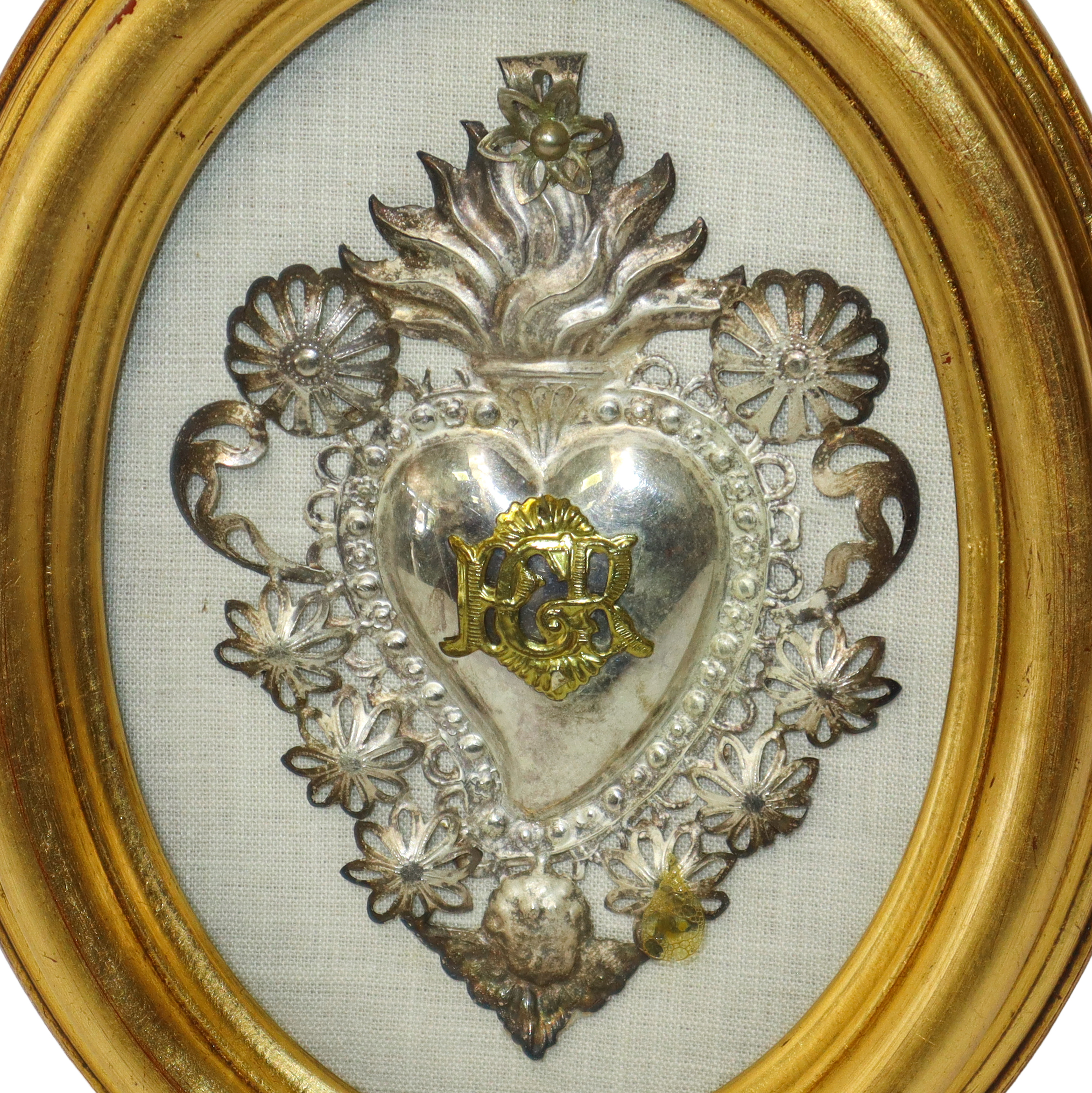 Coppia Ex Voto, argento cesellato con cornice ovale dorata