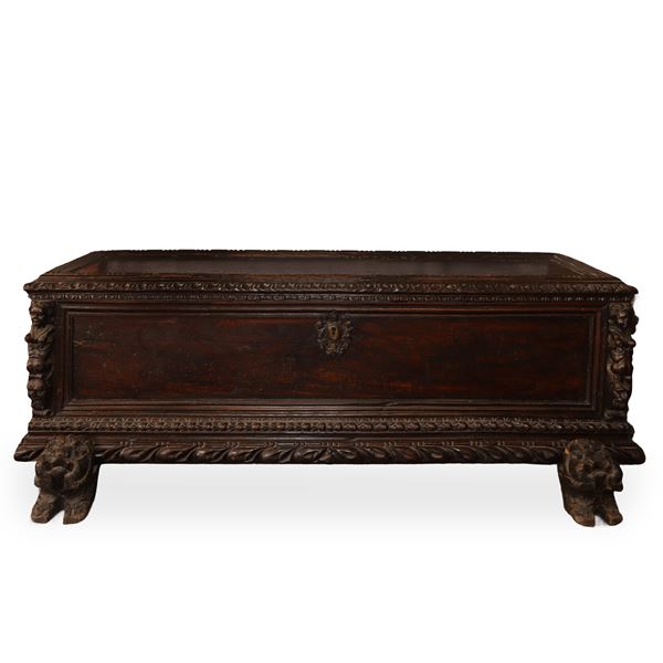 Walnut chest with lion heads