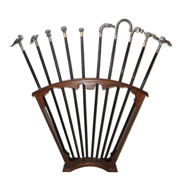 Rack with 10 walking sticks with handles featuring various subjects in 925 silver