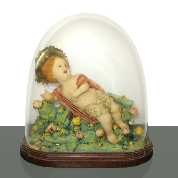 Baby Jesus in wax model in a display case