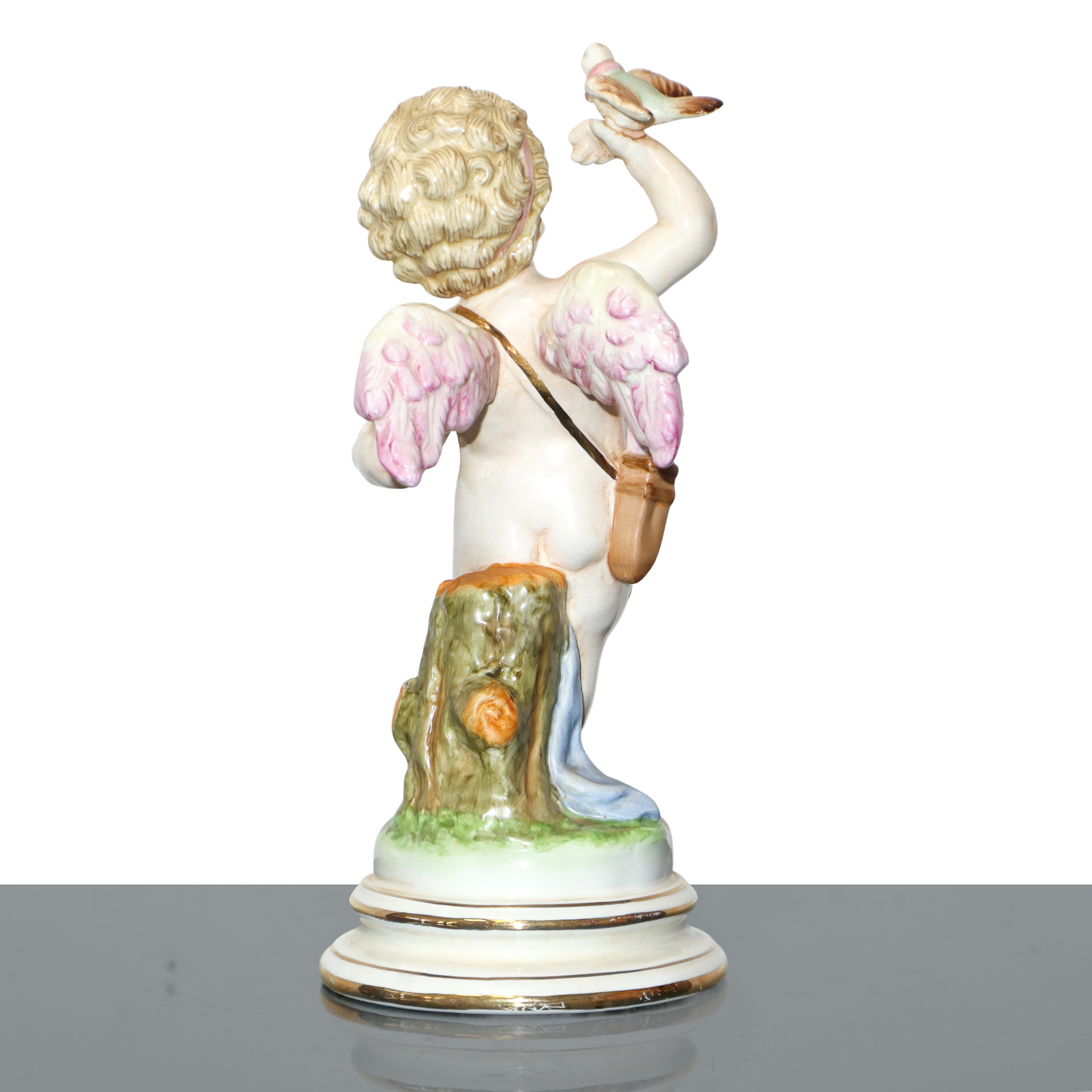 Coppia di putti, sculture in porcellana policroma