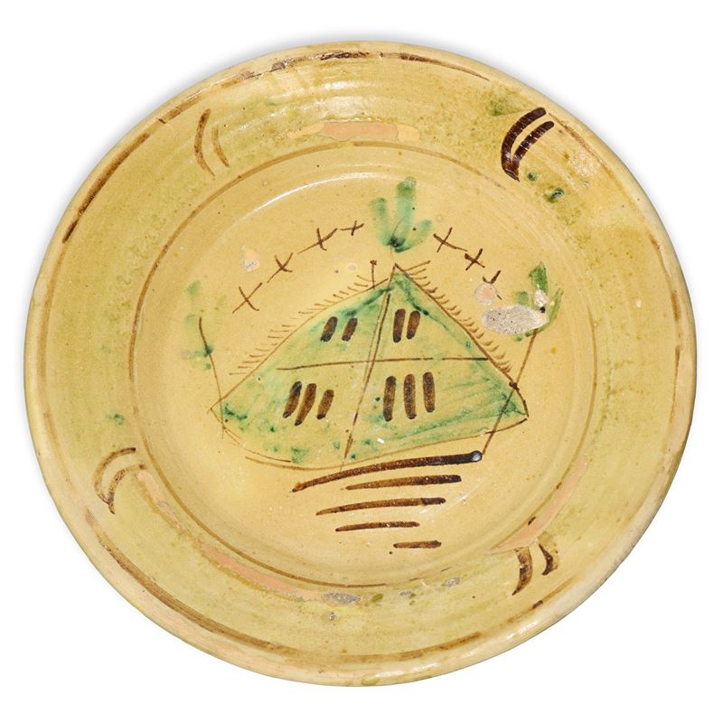 Piatto in maiolica di Caltagirone, fine XIX secolo, dipinto a mano in policromia con verde e mang...