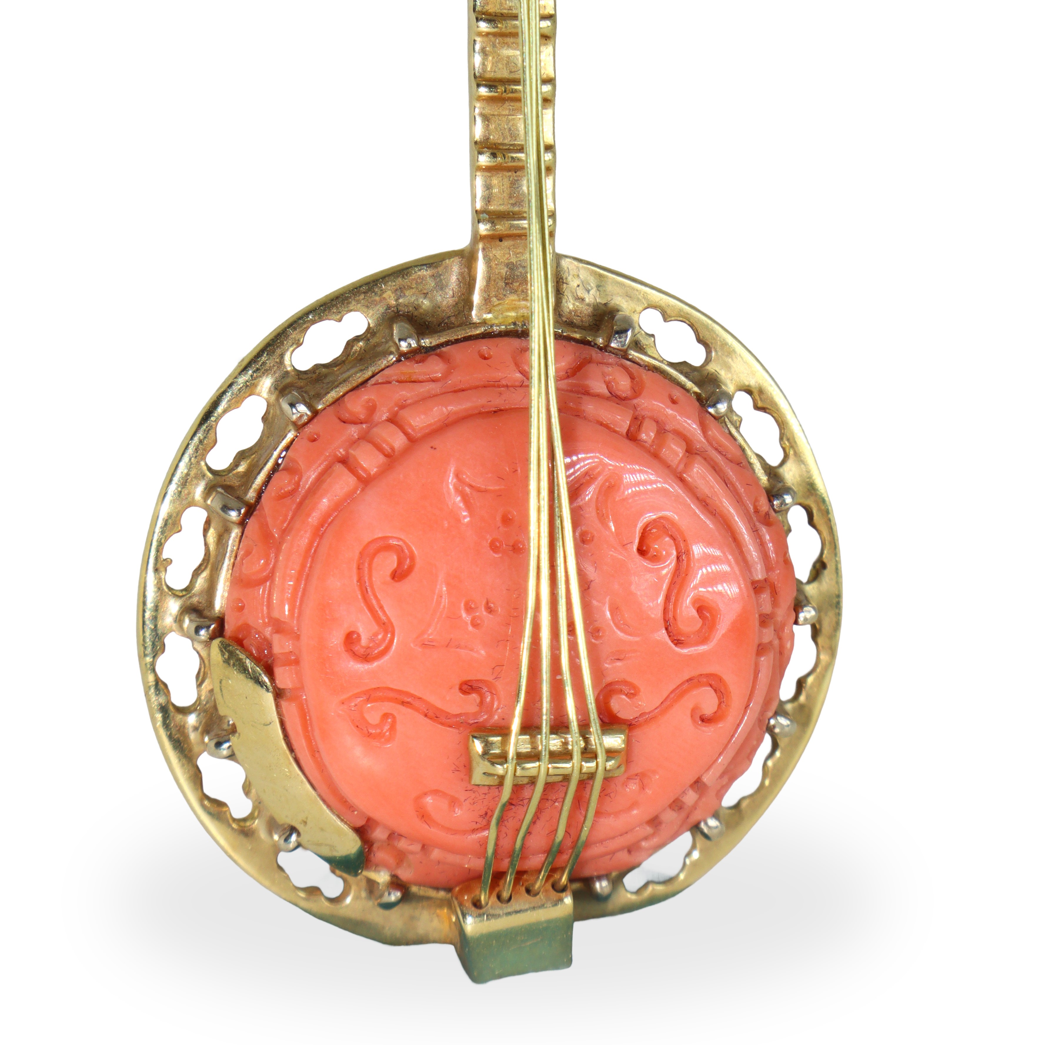 Spilla a guisa di mandolino in oro 750 giallo e corallo