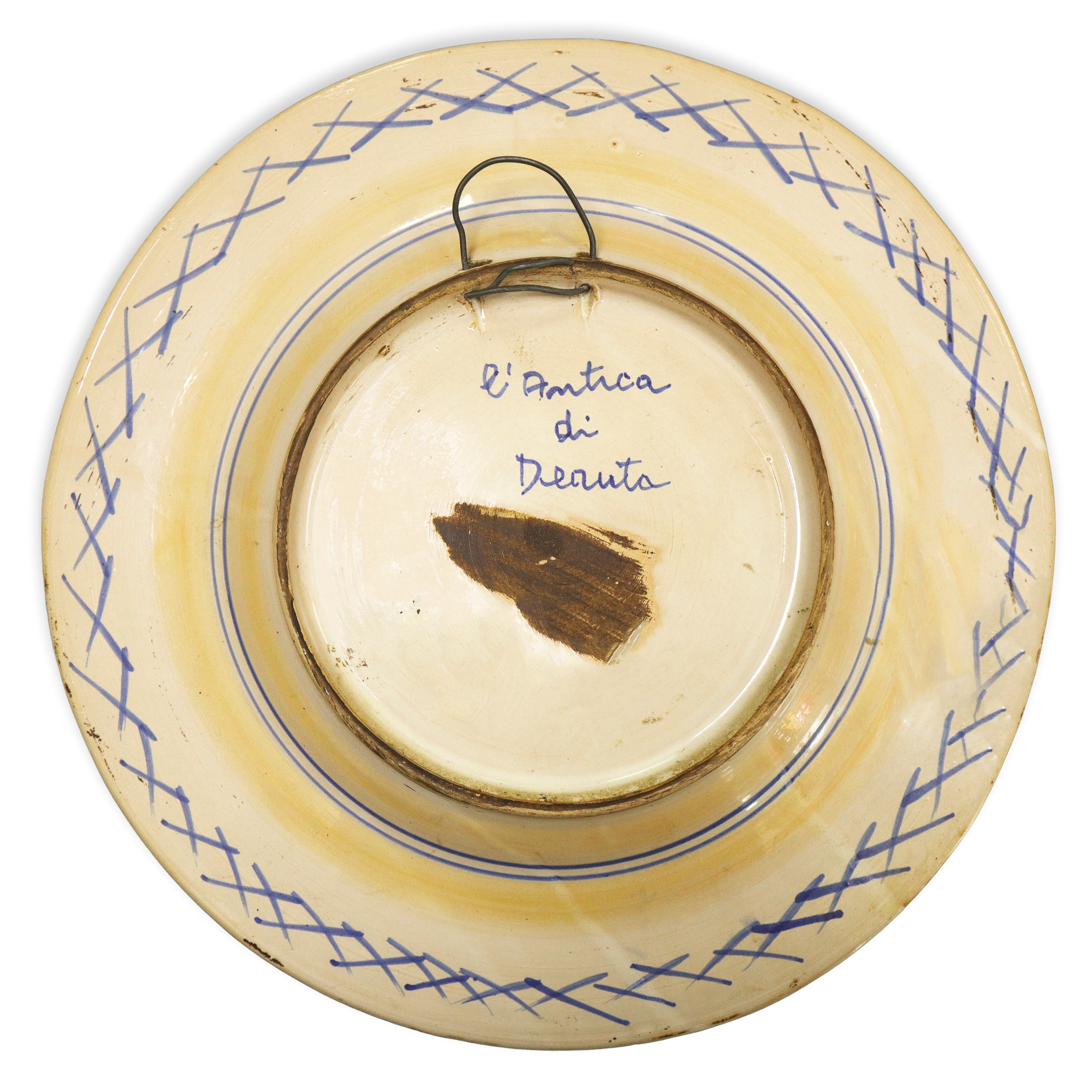 Piatto in maiolica dipinta policroma con fiore sul fronte