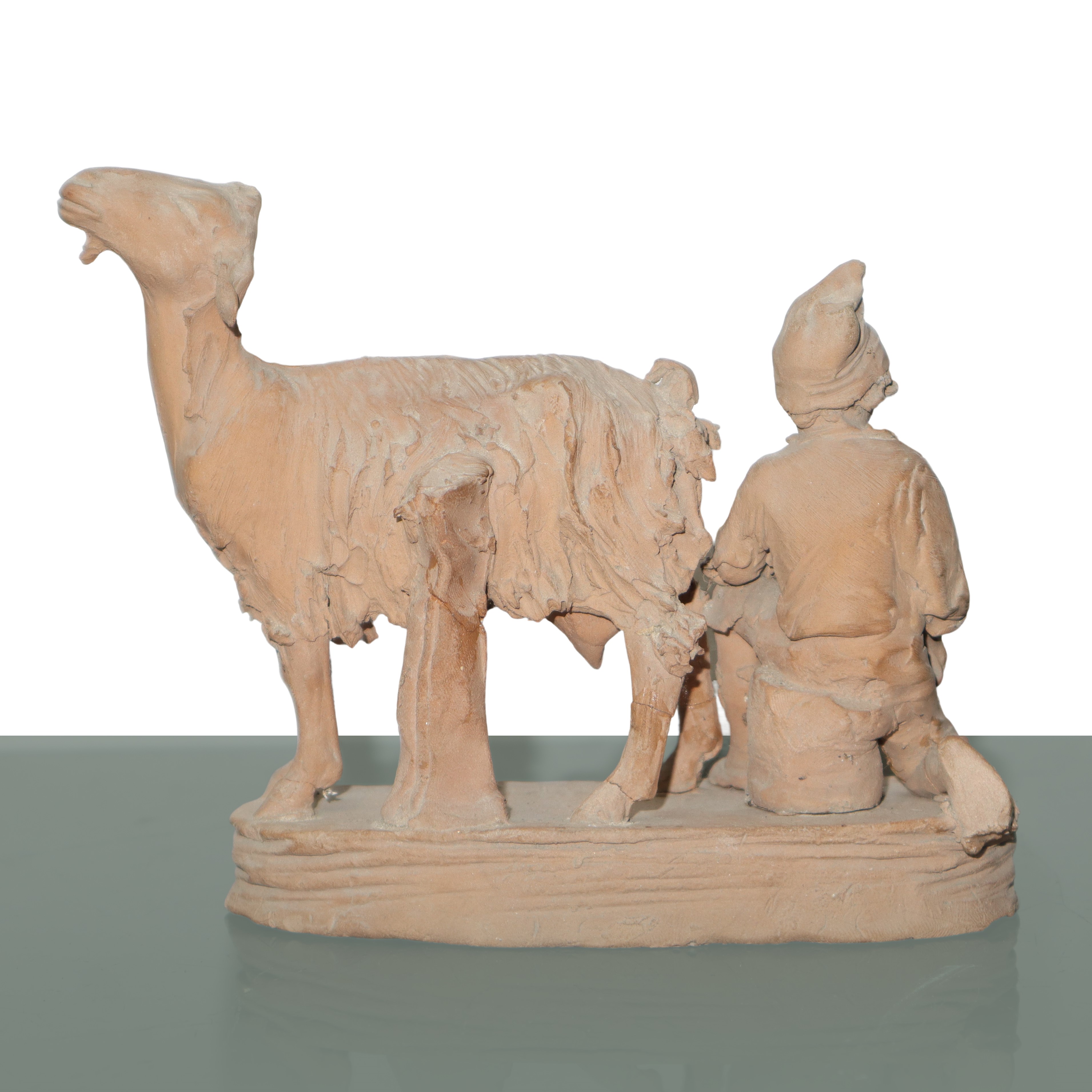 Pastore che munge una capra