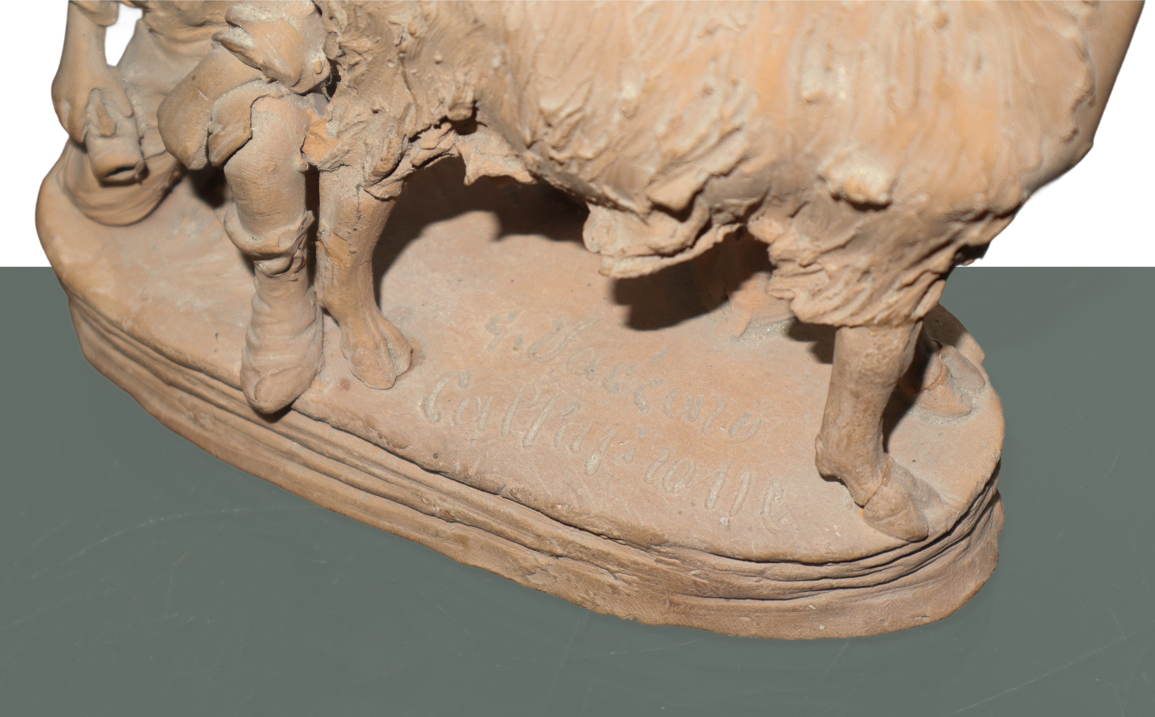 Pastore che munge una capra