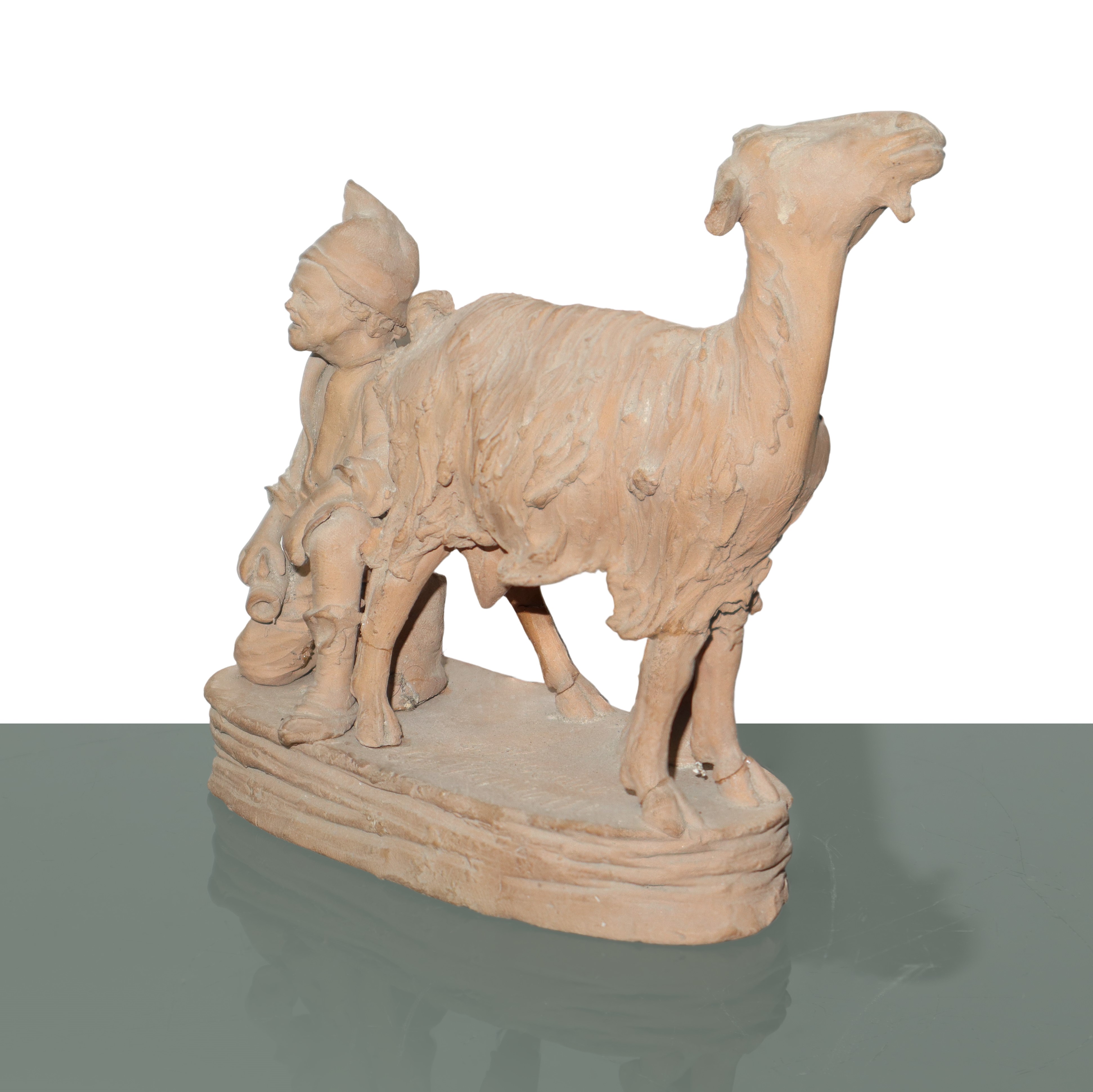 Pastore che munge una capra