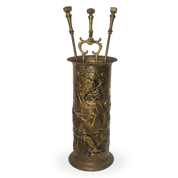 Embossed metal cylinder with fireplace tools