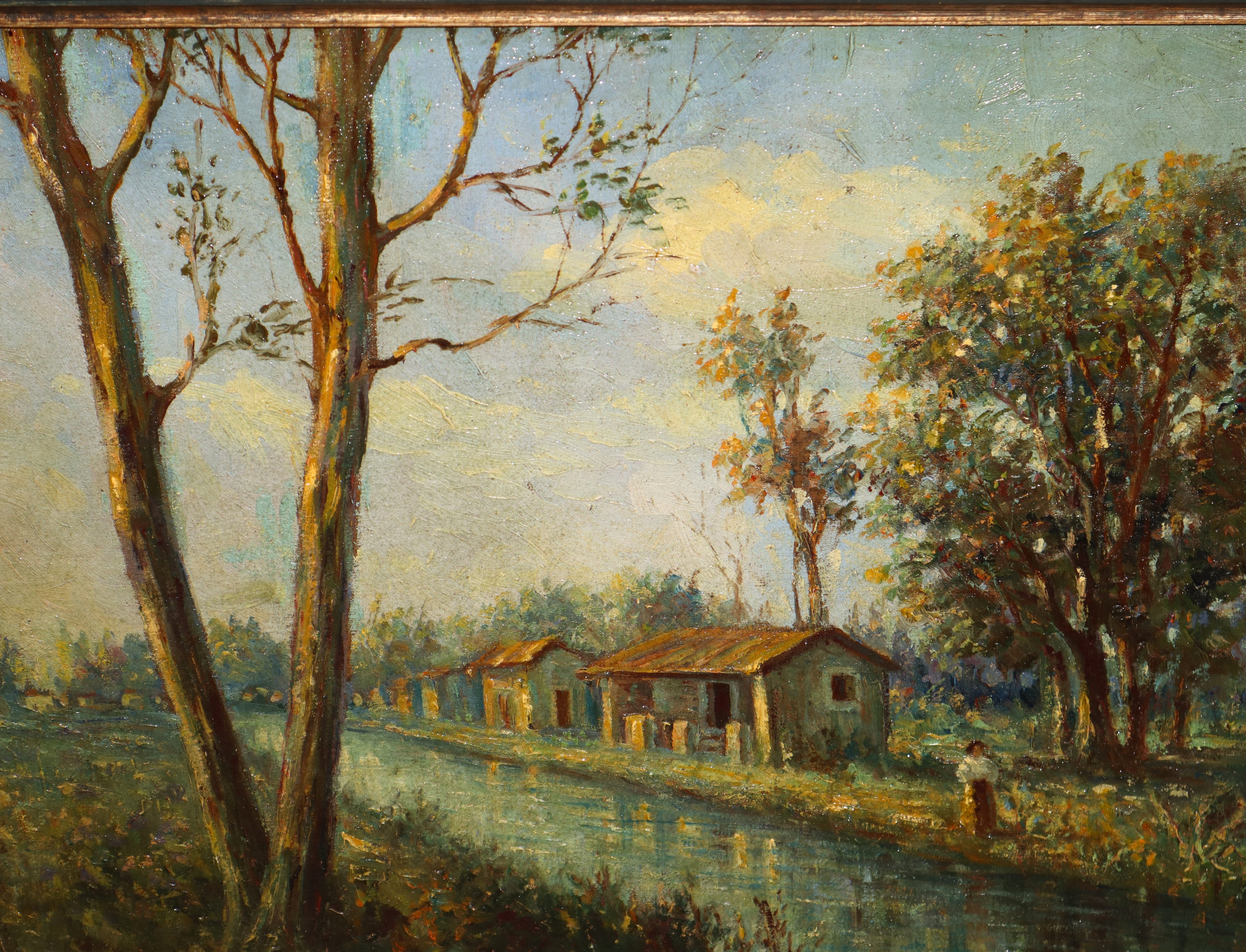 Paesaggio fluviale con casa e alberi