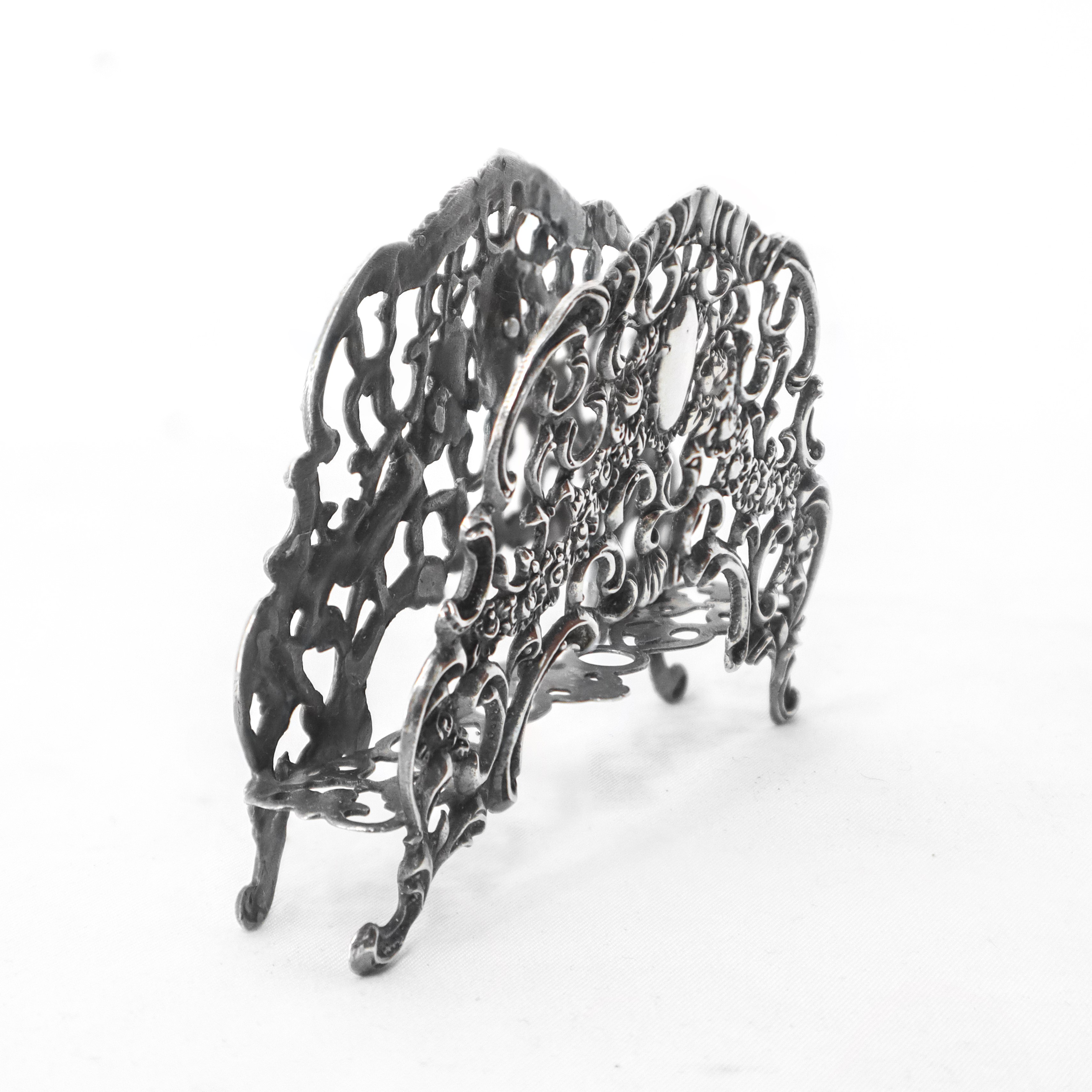 Portatovaglioli in argento 800 con lavorazione di fiori