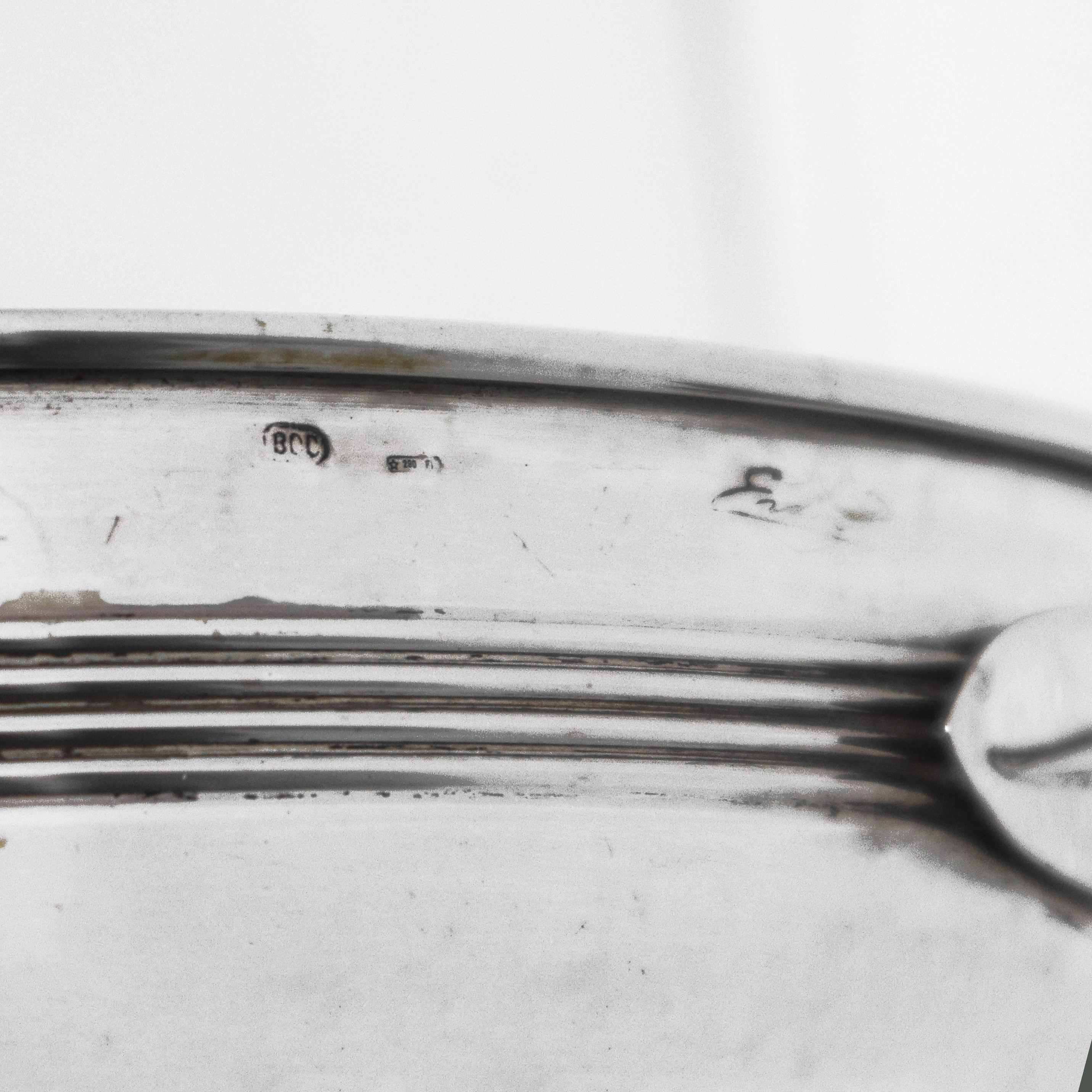 Centrotavola rotondo in argento 800 con fiocco